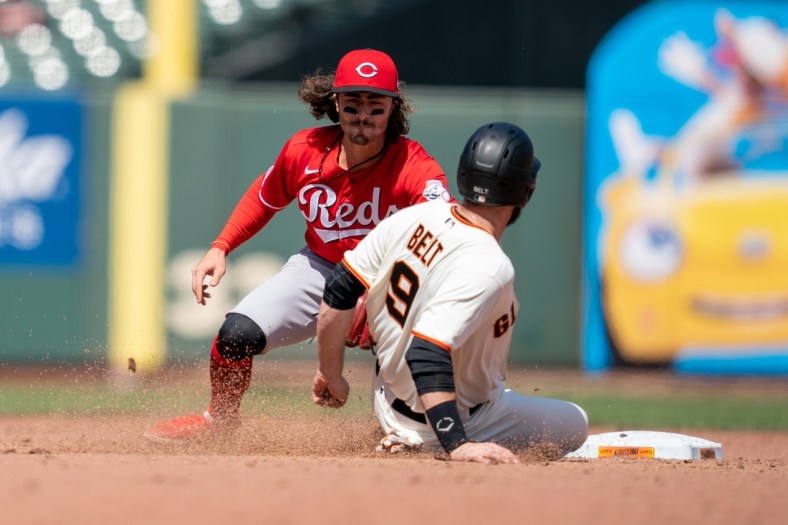 Apr 14, 2021; San Francisco, California, USA; San Francisco Giants first baseman Brandon Belt (9) is caught stealing second base by Cincinnati Reds second baseman Jonathan India (6) during the sixth inning at Oracle Park. Mandatory Credit: Neville E. Guard-USA TODAY Sports