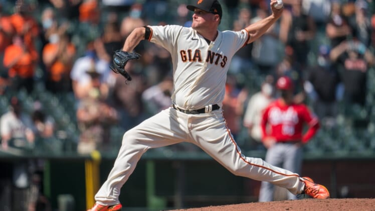 Apr 14, 2021; San Francisco, California, USA; San Francisco Giants relief pitcher Jake McGee (17) delivers a pitch during the ninth inning against the Cincinnati Reds at Oracle Park. Mandatory Credit: Neville E. Guard-USA TODAY Sports