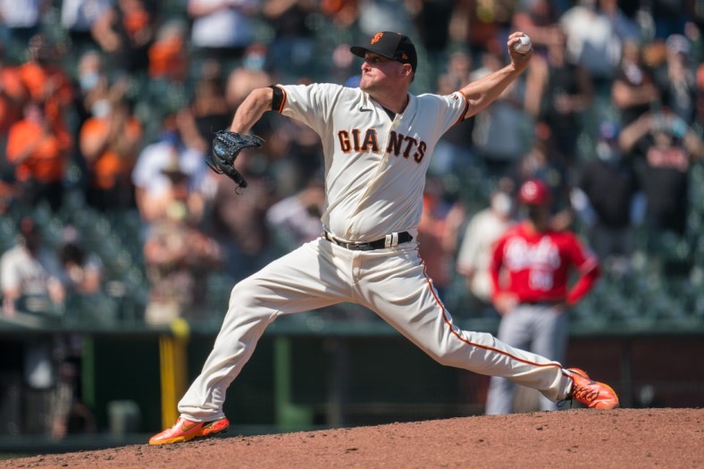Apr 14, 2021; San Francisco, California, USA; San Francisco Giants relief pitcher Jake McGee (17) delivers a pitch during the ninth inning against the Cincinnati Reds at Oracle Park. Mandatory Credit: Neville E. Guard-USA TODAY Sports