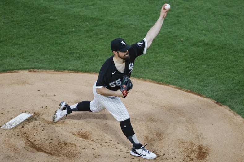 Apr 14, 2021; Chicago, Illinois, USA; Chicago White Sox starting pitcher Carlos Rodon (55) delivers against the Cleveland Indians during the first inning at Guaranteed Rate Field. Mandatory Credit: Kamil Krzaczynski-USA TODAY Sports