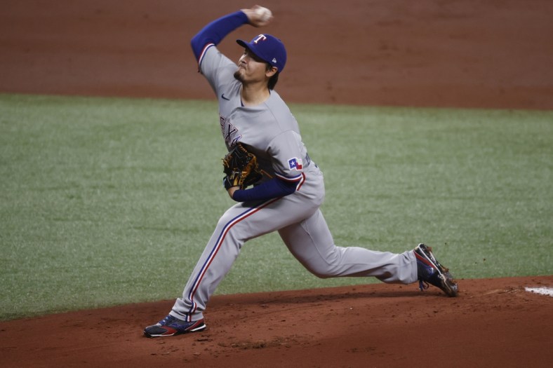 Apr 14, 2021; St. Petersburg, Florida, USA; Texas Rangers starting pitcher Kohei Arihara (35) throws a pitch during the first inning against the Tampa Bay Rays at Tropicana Field. Mandatory Credit: Kim Klement-USA TODAY Sports