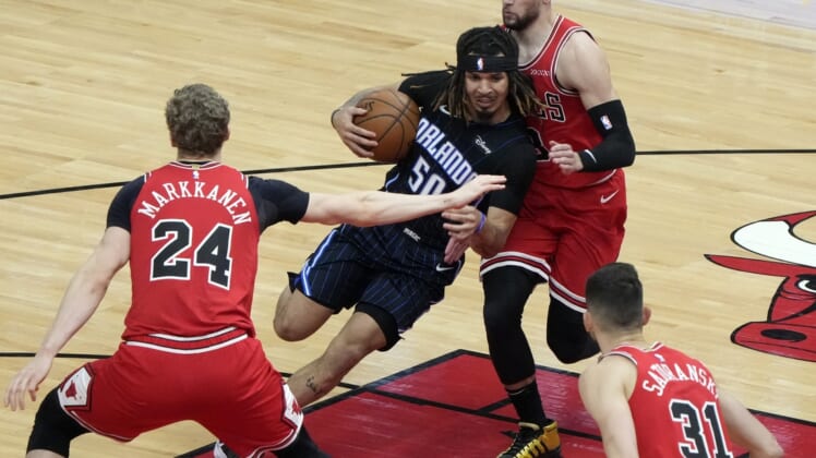Apr 14, 2021; Chicago, Illinois, USA; Orlando Magic guard Cole Anthony (50) drives to the basket against Chicago Bulls guard Zach LaVine (8) during the second quarter at the United Center. Mandatory Credit: Mike Dinovo-USA TODAY Sports
