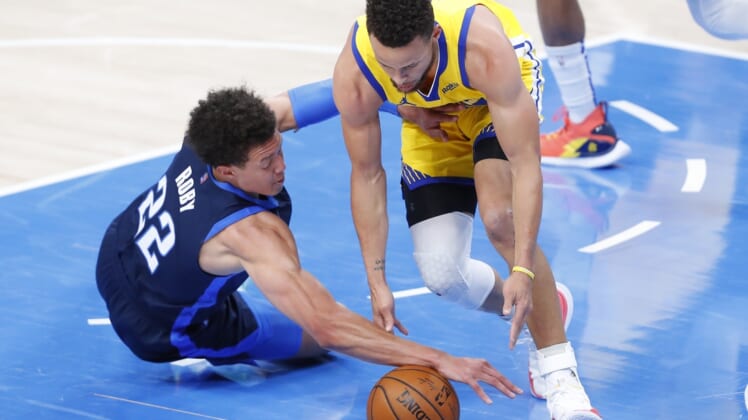 Apr 14, 2021; Oklahoma City, Oklahoma, USA; Oklahoma City Thunder center Isaiah Roby (22) and Golden State Warriors guard Stephen Curry (30) battle for a loose ball during the first quarter at Chesapeake Energy Arena. Mandatory Credit: Alonzo Adams-USA TODAY Sports