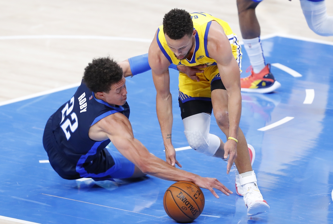 Apr 14, 2021; Oklahoma City, Oklahoma, USA; Oklahoma City Thunder center Isaiah Roby (22) and Golden State Warriors guard Stephen Curry (30) battle for a loose ball during the first quarter at Chesapeake Energy Arena. Mandatory Credit: Alonzo Adams-USA TODAY Sports