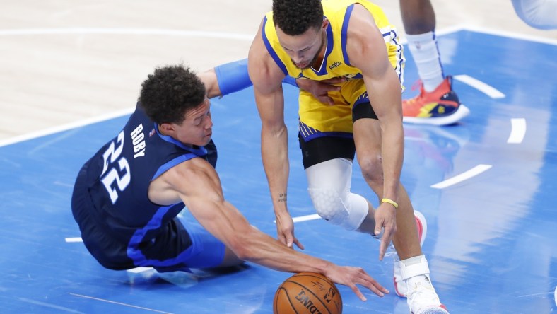 Apr 14, 2021; Oklahoma City, Oklahoma, USA; Oklahoma City Thunder center Isaiah Roby (22) and Golden State Warriors guard Stephen Curry (30) battle for a loose ball during the first quarter at Chesapeake Energy Arena. Mandatory Credit: Alonzo Adams-USA TODAY Sports