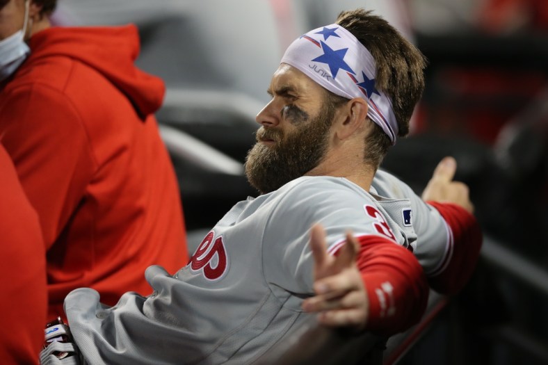Apr 14, 2021; New York City, New York, USA; Philadelphia Phillies right fielder Bryce Harper (3) reacts in the dugout during the seventh inning against the New York Mets at Citi Field. Mandatory Credit: Brad Penner-USA TODAY Sports