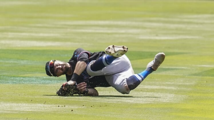 Apr 15, 2021; Cumberland, Georgia, USA; Miami Marlins second baseman Jon Berti (5) makes a running catch in shallow center field on a ball hit by Atlanta Braves second baseman Ozzie Albies (1) (not shown) during the second inning at Truist Park. Mandatory Credit: Dale Zanine-USA TODAY Sports