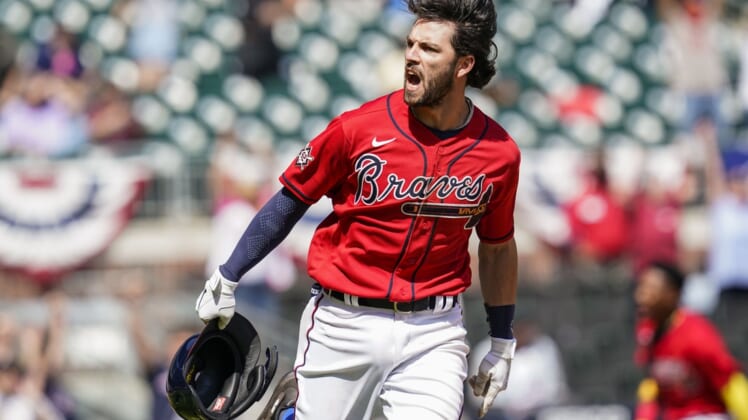 Apr 15, 2021; Cumberland, Georgia, USA; Atlanta Braves shortstop Dansby Swanson (7) reacts after getting the game winning hit against the Miami Marlins during the ninth inning at Truist Park. Mandatory Credit: Dale Zanine-USA TODAY Sports