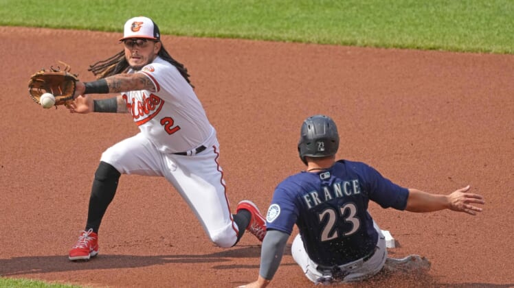 Apr 15, 2021; Baltimore, Maryland, USA; Seattle Mariners second baseman Ty France (23) slides into second base ahead of the throw to Baltimore Orioles shortstop Freddy Galvis (3) in the second inning at Oriole Park at Camden Yards. Mandatory Credit: Mitch Stringer-USA TODAY Sports