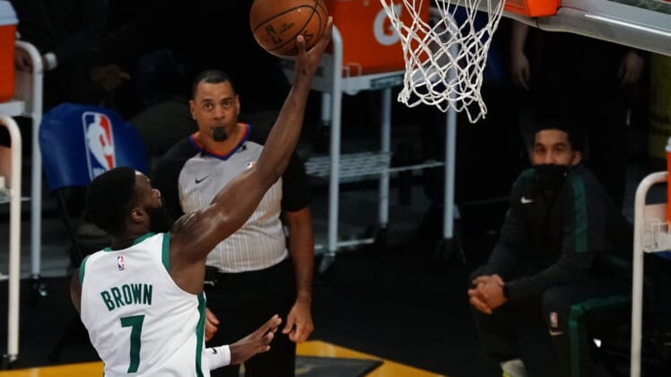 Apr 15, 2021; Los Angeles, California, USA; Boston Celtics guard Jaylen Brown (7) moves in for a basket against the Los Angeles Lakers during the second half at Staples Center. Mandatory Credit: Gary A. Vasquez-USA TODAY Sports