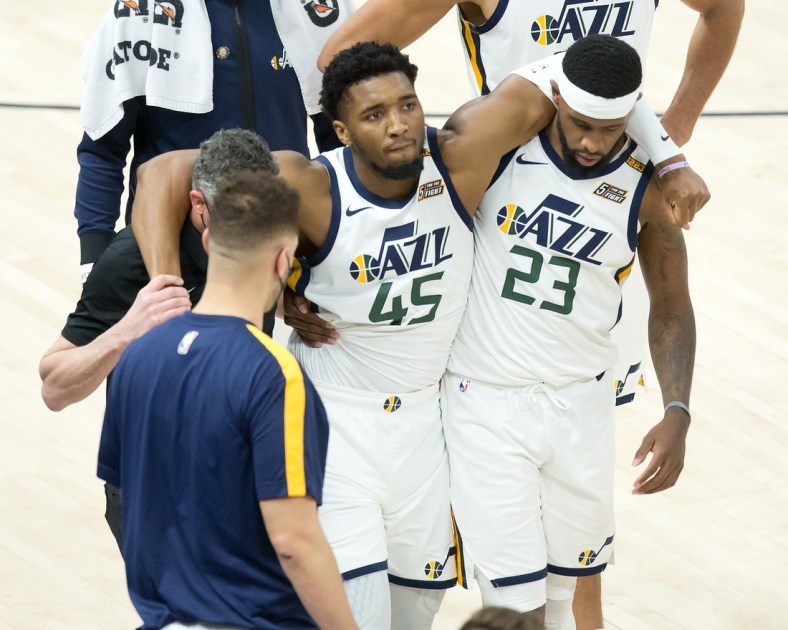 Apr 16, 2021; Salt Lake City, Utah, USA; Utah Jazz guard Donovan Mitchell (45) is helped off the court after suffering an apparent injury during the second half against the Indiana Pacers at Vivint Smart Home Arena. Mandatory Credit: Russell Isabella-USA TODAY Sports
