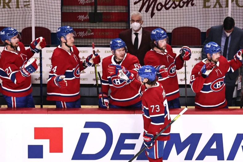 Apr 16, 2021; Montreal, Quebec, CAN; Montreal Canadiens right wing Tyler Toffoli (73) celebrates his goal against Calgary Flames with teammates during the second period at Bell Centre. Mandatory Credit: Jean-Yves Ahern-USA TODAY Sports