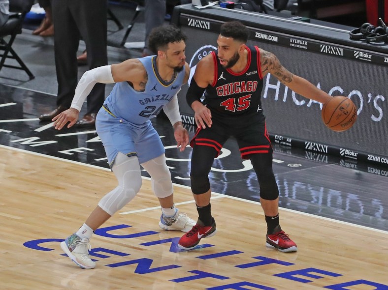 Apr 16, 2021; Chicago, Illinois, USA; Chicago Bulls guard Denzel Valentine (45) is defended by Memphis Grizzlies forward Dillon Brooks (24) during the second quarter at the United Center. Mandatory Credit: Dennis Wierzbicki-USA TODAY Sports