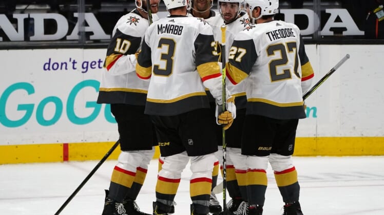 Apr 16, 2021; Anaheim, California, USA; Vegas Golden Knights center Nicolas Roy (10) celebrates with defenseman Brayden McNabb (3) defenseman Shea Theodore (27) left wing Tomas Jurco (13) and left wing Max Pacioretty (67) his goal scored against the Anaheim Ducks during the second period at Honda Center. Mandatory Credit: Gary A. Vasquez-USA TODAY Sports