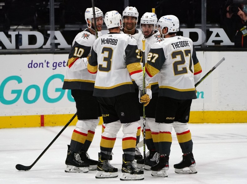 Apr 16, 2021; Anaheim, California, USA; Vegas Golden Knights center Nicolas Roy (10) celebrates with defenseman Brayden McNabb (3) defenseman Shea Theodore (27) left wing Tomas Jurco (13) and left wing Max Pacioretty (67) his goal scored against the Anaheim Ducks during the second period at Honda Center. Mandatory Credit: Gary A. Vasquez-USA TODAY Sports