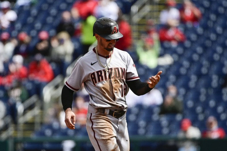 Apr 17, 2021; Washington, District of Columbia, USA; Arizona Diamondbacks left fielder Tim Locastro (16) looks at his hand after being thrown out at second base against the Washington Nationals at Nationals Park. Mandatory Credit: Tommy Gilligan-USA TODAY Sports