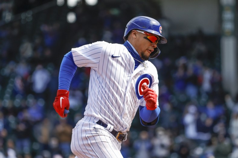 Apr 17, 2021; Chicago, Illinois, USA; Chicago Cubs shortstop Javier Baez (9) rounds the bases after hitting a three-run home run against the Atlanta Braves during the third inning at Wrigley Field. Mandatory Credit: Kamil Krzaczynski-USA TODAY Sports