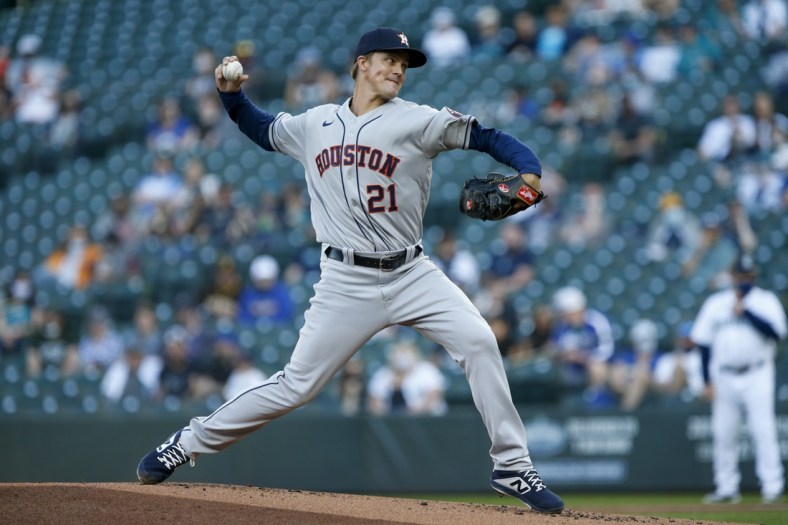 Apr 17, 2021; Seattle, Washington, USA; Houston Astros starting pitcher Zack Greinke (21) throws against the Seattle Mariners during the first inning at T-Mobile Park. Mandatory Credit: Joe Nicholson-USA TODAY Sports