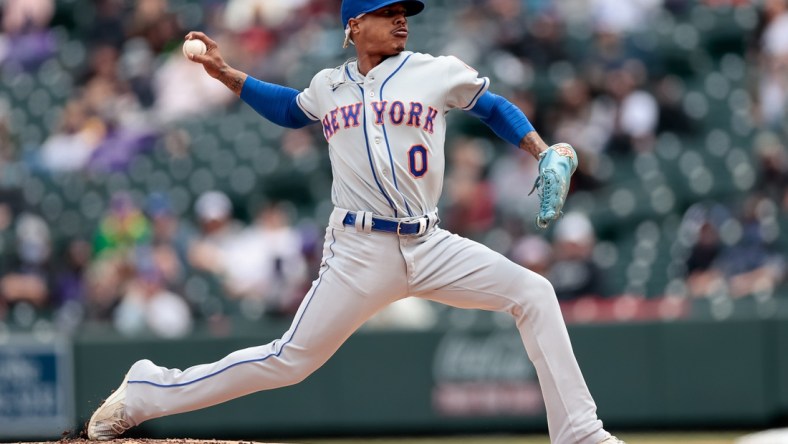 Apr 18, 2021; Denver, Colorado, USA; New York Mets starting pitcher Marcus Stroman (0) pitches in the first inning against the Colorado Rockies at Coors Field. Mandatory Credit: Isaiah J. Downing-USA TODAY Sports