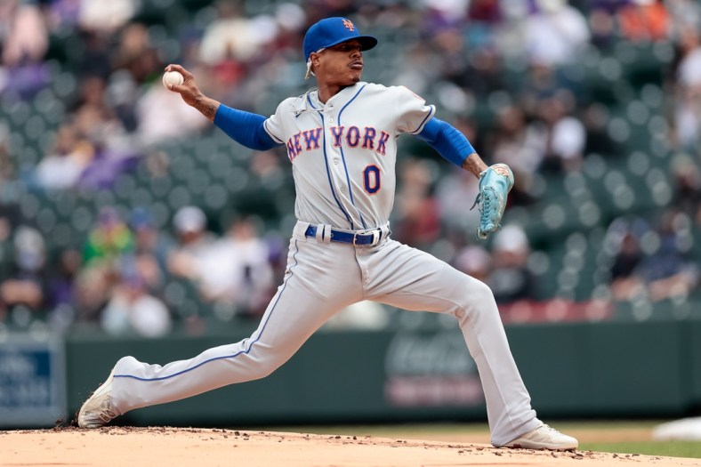 Apr 18, 2021; Denver, Colorado, USA; New York Mets starting pitcher Marcus Stroman (0) pitches in the first inning against the Colorado Rockies at Coors Field. Mandatory Credit: Isaiah J. Downing-USA TODAY Sports