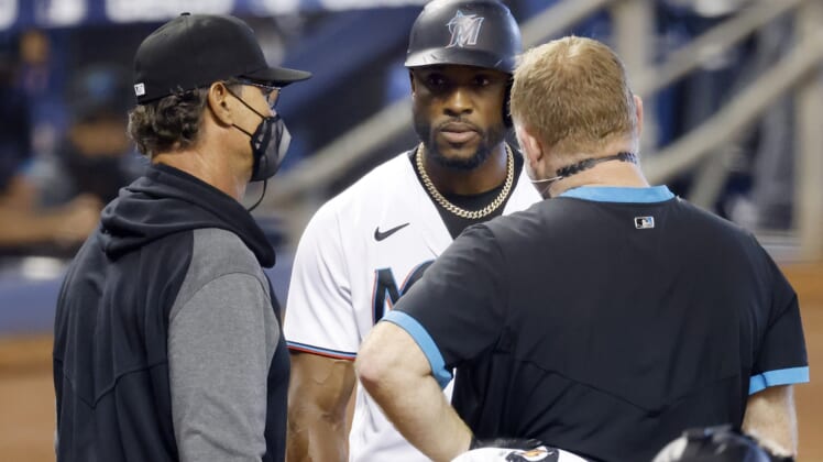 Apr 18, 2021; Miami, Florida, USA;  Florida Marlins batter Starling Marte (6) talks to manager Don Mattingly (8) before being removed due to injury during his at bat in the ninth inning against the San Francisco Giants at loanDepot Park. Mandatory Credit: Rhona Wise-USA TODAY Sports