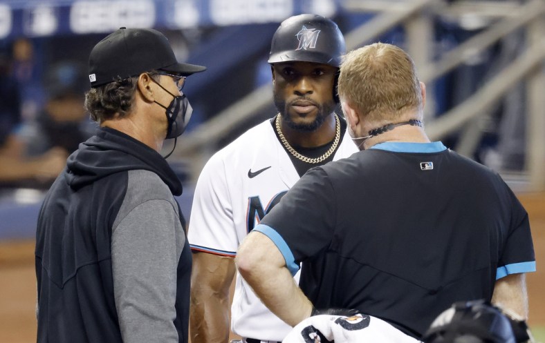 Apr 18, 2021; Miami, Florida, USA;  Florida Marlins batter Starling Marte (6) talks to manager Don Mattingly (8) before being removed due to injury during his at bat in the ninth inning against the San Francisco Giants at loanDepot Park. Mandatory Credit: Rhona Wise-USA TODAY Sports