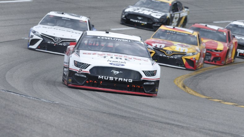 Apr 18, 2021; Richmond, Virginia, USA; NASCAR Cup Series driver Brad Keselowski (2) races during the Toyota Owners 400 at Richmond International Raceway. Mandatory Credit: Amber Searls-USA TODAY Sports