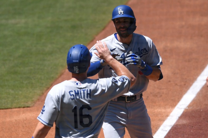 Apr 18, 2021; San Diego, California, USA; Los Angeles Dodgers center fielder fielder Chris Taylor (R) is congratulated by catcher Will Smith (16) after hitting a two-run home run during the second inning against the San Diego Padres at Petco Park. Mandatory Credit: Orlando Ramirez-USA TODAY Sports