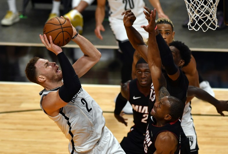 Apr 18, 2021; Miami, Florida, USA; Brooklyn Nets forward Blake Griffin (2) takes shot over Miami Heat forward Andre Iguodala (28) during the first half at American Airlines Arena. Mandatory Credit: Jim Rassol-USA TODAY Sports