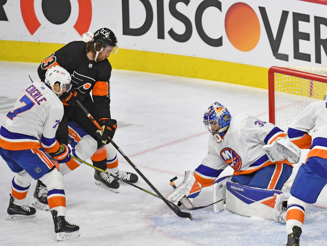 Apr 18, 2021; Philadelphia, Pennsylvania, USA; New York Islanders goaltender Ilya Sorokin (30) makes a save against Philadelphia Flyers center Kevin Hayes (13) during the second period at Wells Fargo Center. Mandatory Credit: Eric Hartline-USA TODAY Sports