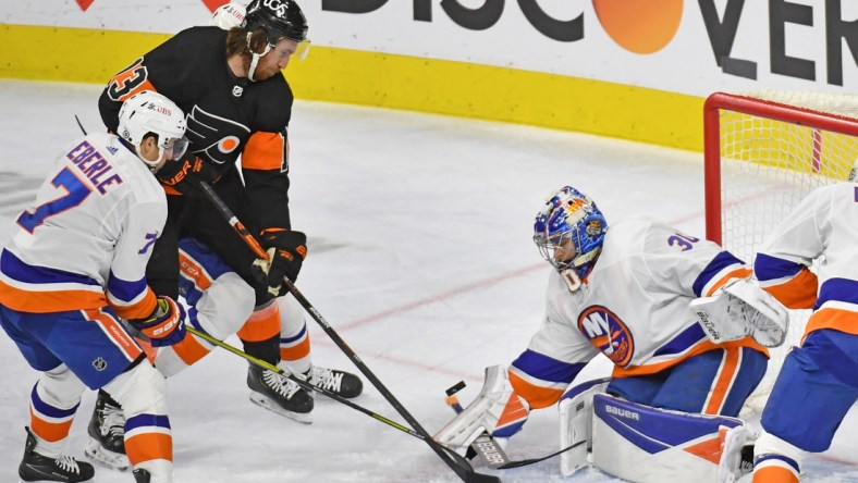 Apr 18, 2021; Philadelphia, Pennsylvania, USA; New York Islanders goaltender Ilya Sorokin (30) makes a save against Philadelphia Flyers center Kevin Hayes (13) during the second period at Wells Fargo Center. Mandatory Credit: Eric Hartline-USA TODAY Sports