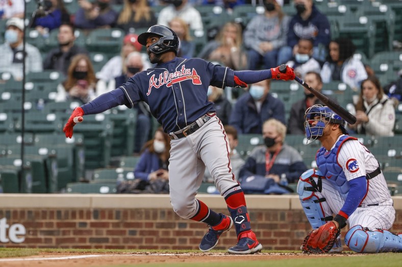 Apr 18, 2021; Chicago, Illinois, USA; Atlanta Braves center fielder Guillermo Heredia (38) hits a two-run home run against the Chicago Cubs during the first inning at Wrigley Field. Mandatory Credit: Kamil Krzaczynski-USA TODAY Sports