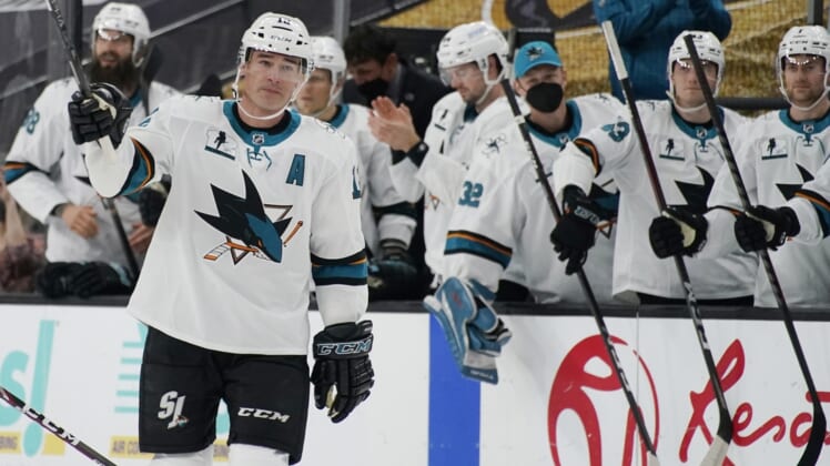 Apr 19, 2021; Las Vegas, Nevada, USA; San Jose Sharks center Patrick Marleau (12) waves to the crowd during a small ceremony to mark his passing Gordie Howe for most NHL games played in the first period at T-Mobile Arena. Mandatory Credit:  John Locher/POOL PHOTOS-USA TODAY Sports