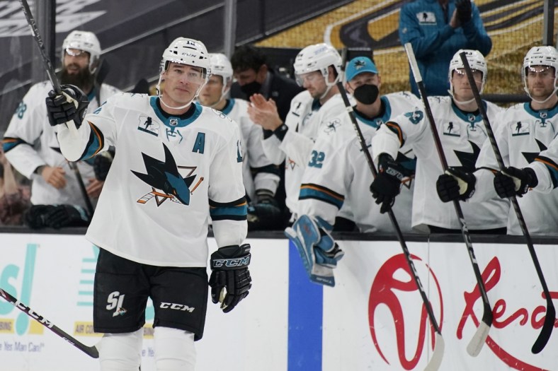 Apr 19, 2021; Las Vegas, Nevada, USA; San Jose Sharks center Patrick Marleau (12) waves to the crowd during a small ceremony to mark his passing Gordie Howe for most NHL games played in the first period at T-Mobile Arena. Mandatory Credit:  John Locher/POOL PHOTOS-USA TODAY Sports