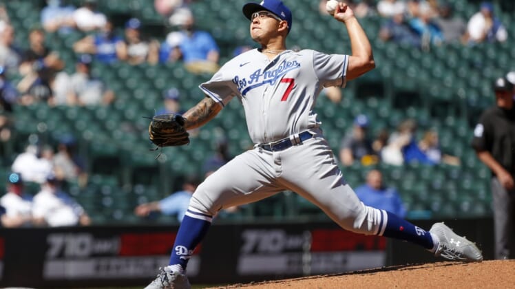 Apr 20, 2021; Seattle, Washington, USA; Los Angeles Dodgers starting pitcher Julio Urias (7) throws against the Seattle Mariners during the third inning at T-Mobile Park. Mandatory Credit: Joe Nicholson-USA TODAY Sports