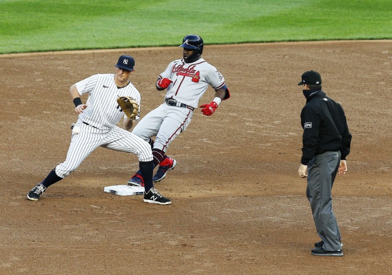 Apr 20, 2021; Bronx, New York, USA; Atlanta Braves center fielder Guillermo Heredia (38) goes into second base after hitting a double against the New York Yankees during the third inning at Yankee Stadium. Mandatory Credit: Andy Marlin-USA TODAY Sports