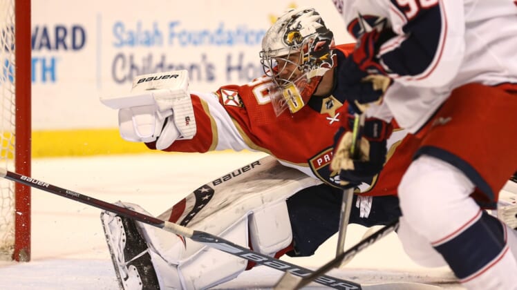 Apr 20, 2021; Sunrise, Florida, USA; Florida Panthers goaltender Spencer Knight (30) attempts to make a save against the Columbus Blue Jackets during the first period at BB&T Center. Mandatory Credit: Sam Navarro-USA TODAY Sports
