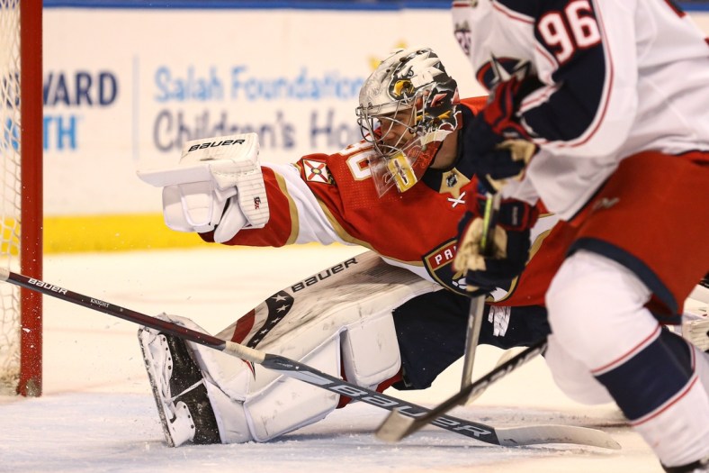 Apr 20, 2021; Sunrise, Florida, USA; Florida Panthers goaltender Spencer Knight (30) attempts to make a save against the Columbus Blue Jackets during the first period at BB&T Center. Mandatory Credit: Sam Navarro-USA TODAY Sports