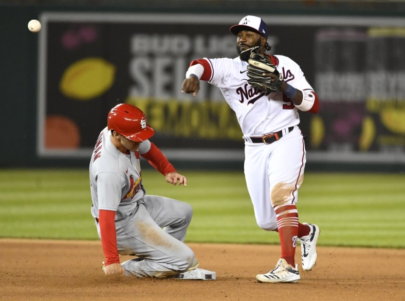 Apr 20, 2021; Washington, District of Columbia, USA; Washington Nationals second baseman Josh Harrison (5) forces out St. Louis Cardinals third baseman Tommy Edman (19) and throws to first to complete a double play during the sixth inning at Nationals Park. Mandatory Credit: Brad Mills-USA TODAY Sports