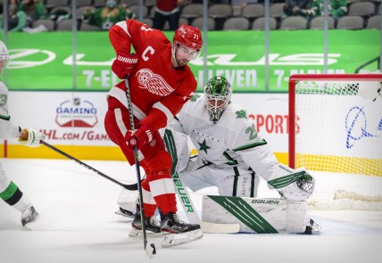 Apr 20, 2021; Dallas, Texas, USA; Dallas Stars goaltender Jake Oettinger (29) defends against Detroit Red Wings center Dylan Larkin (71) during the first period at the American Airlines Center. Mandatory Credit: Jerome Miron-USA TODAY Sports