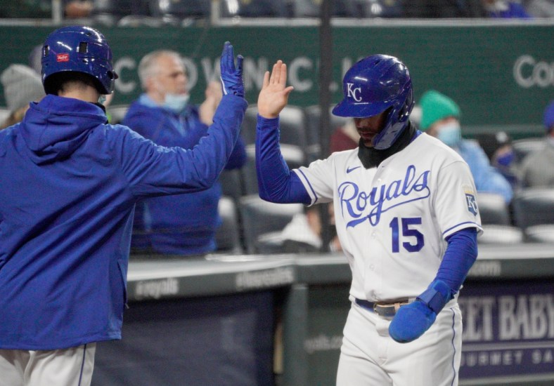 Apr 20, 2021; Kansas City, Missouri, USA; Kansas City Royals second base Whit Merrifield (15) is congratulated after scoring in the third inning against the Tampa Bay Rays at Kauffman Stadium. Mandatory Credit: Denny Medley-USA TODAY Sports