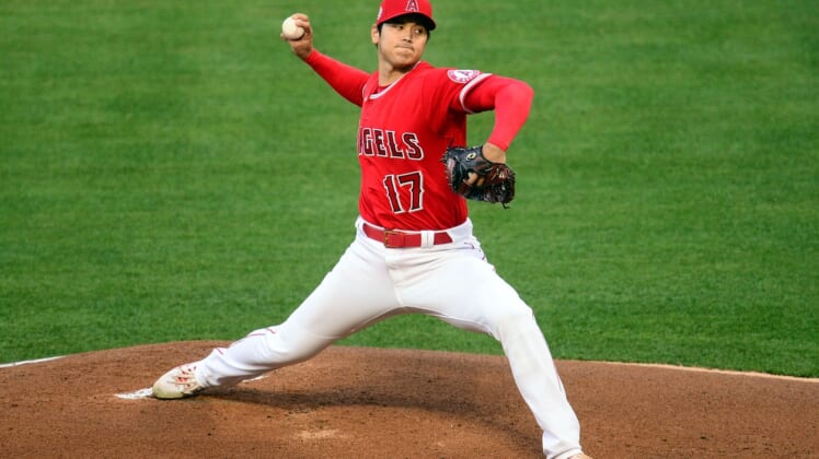 Apr 20, 2021; Anaheim, California, USA; Los Angeles Angels starting pitcher Shohei Ohtani (17) throws against the Texas Rangers during the first inning at Angel Stadium. Mandatory Credit: Gary A. Vasquez-USA TODAY Sports