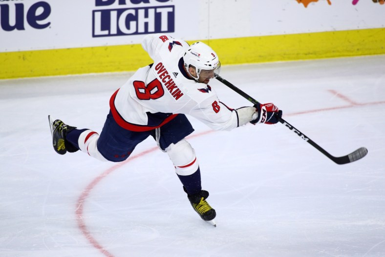 Apr 17, 2021; Philadelphia, Pennsylvania, USA; Washington Capitals left wing Alex Ovechkin (8) takes a shot in the first period against the Philadelphia Flyers at Wells Fargo Center. Mandatory Credit: Kyle Ross-USA TODAY Sports