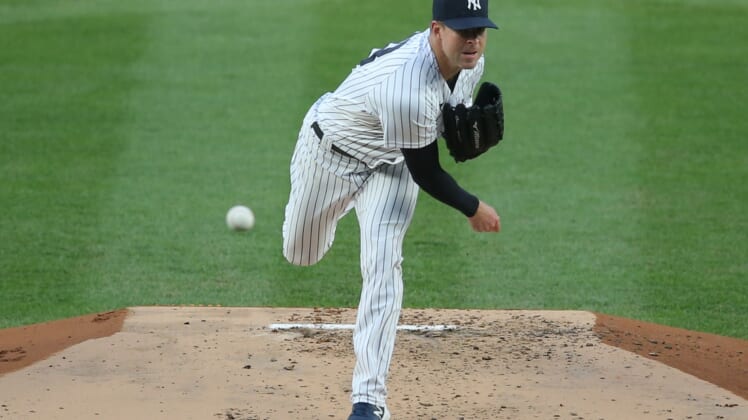 Apr 21, 2021; Bronx, New York, USA; New York Yankees starting pitcher Corey Kluber (28) throws against the Atlanta Braves during the second inning at Yankee Stadium. Mandatory Credit: Brad Penner-USA TODAY Sports