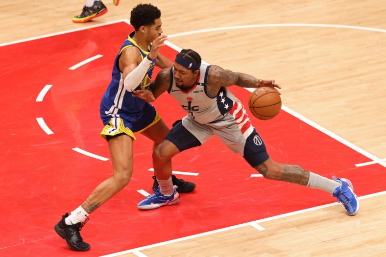 Apr 21, 2021; Washington, District of Columbia, USA; Washington Wizards guard Bradley Beal (3) drives to the basket as Golden State Warriors guard Jordan Poole (3) defends in the second quarter at Capital One Arena. Mandatory Credit: Geoff Burke-USA TODAY Sports