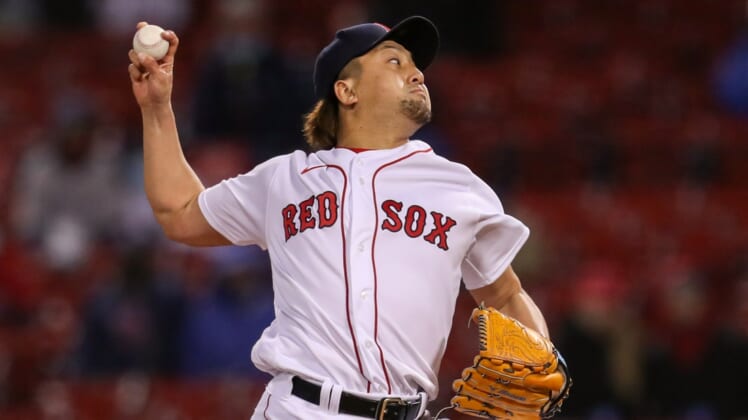 Apr 21, 2021; Boston, Massachusetts, USA; Boston Red Sox relief pitcher Hirokazu Sawamura (19) delivers a pitch against the Toronto Blue Jays during the fifth inning at Fenway Park. Mandatory Credit: Paul Rutherford-USA TODAY Sports