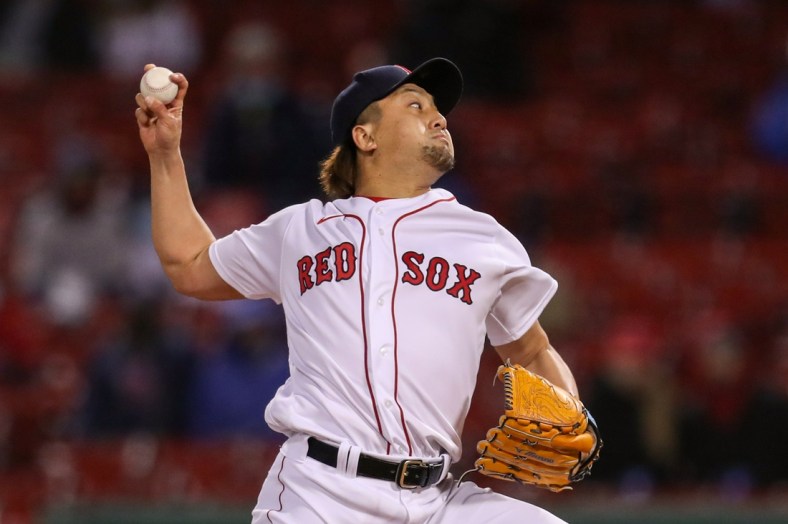 Apr 21, 2021; Boston, Massachusetts, USA; Boston Red Sox relief pitcher Hirokazu Sawamura (19) delivers a pitch against the Toronto Blue Jays during the fifth inning at Fenway Park. Mandatory Credit: Paul Rutherford-USA TODAY Sports