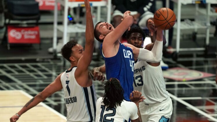 Apr 21, 2021; Los Angeles, California, USA; LA Clippers center Ivica Zubac (40) is defended by Memphis Grizzlies forward Kyle Anderson (1), forward Jaren Jackson Jr. (13) and Ja Morantin the first half at Staples Center. Mandatory Credit: Kirby Lee-USA TODAY Sports