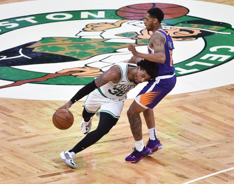 Apr 22, 2021; Boston, Massachusetts, USA;  Boston Celtics guard Marcus Smart (36) controls the ball while Phoenix Suns guard Cameron Payne (15) defends during the first half at TD Garden. Mandatory Credit: Bob DeChiara-USA TODAY Sports