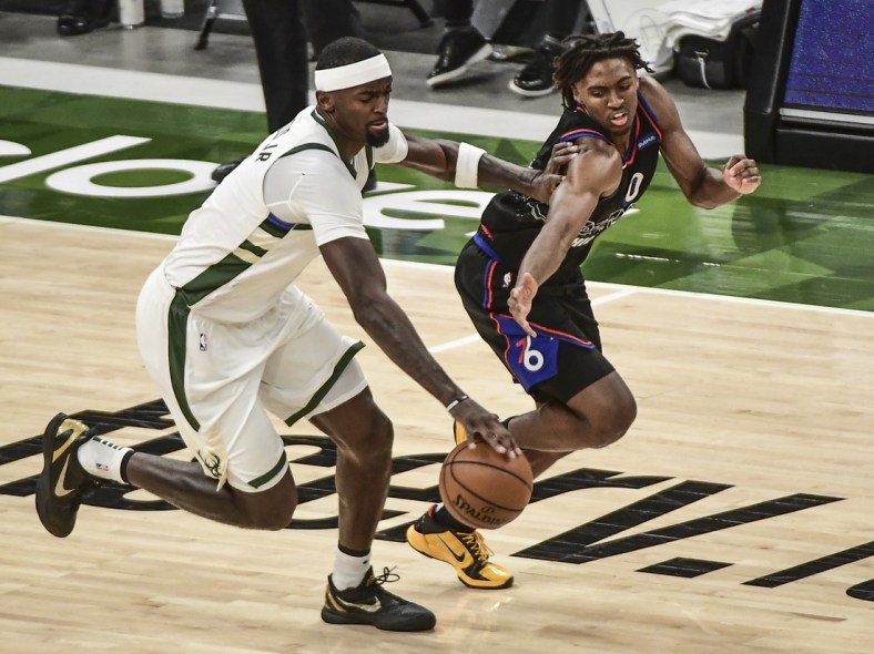 Apr 22, 2021; Milwaukee, Wisconsin, USA; Milwaukee Bucks center Bobby Portis (9) steals the ball from Philadelphia 76ers guard Tyrese Maxey (0) in the first quarter at Fiserv Forum. Mandatory Credit: Benny Sieu-USA TODAY Sports